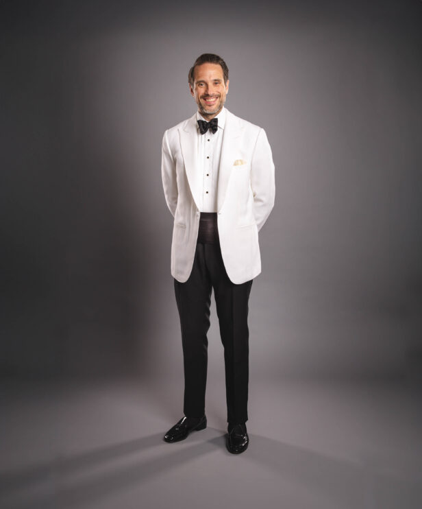 White dinner jacket with peaked lapel.