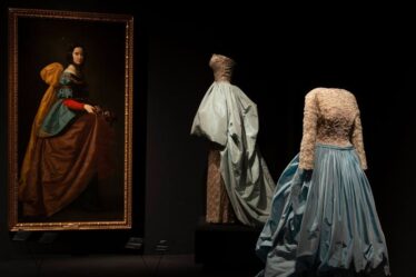 Evening ensemble of cotton tulle dress, metal thread embroidery on rayon satin, and silk taffeta overskirt, designed by Balenciaga, and _St. Isabella of Portugal_ by Francisco de Zurbarán.