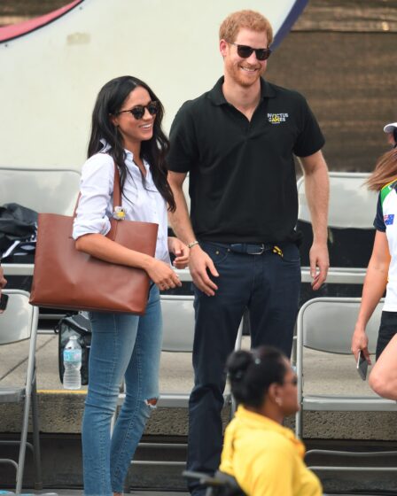 Image may contain Prince Harry Duke of Sussex Meghan Duchess of Sussex Accessories Bag Handbag Glasses and Person