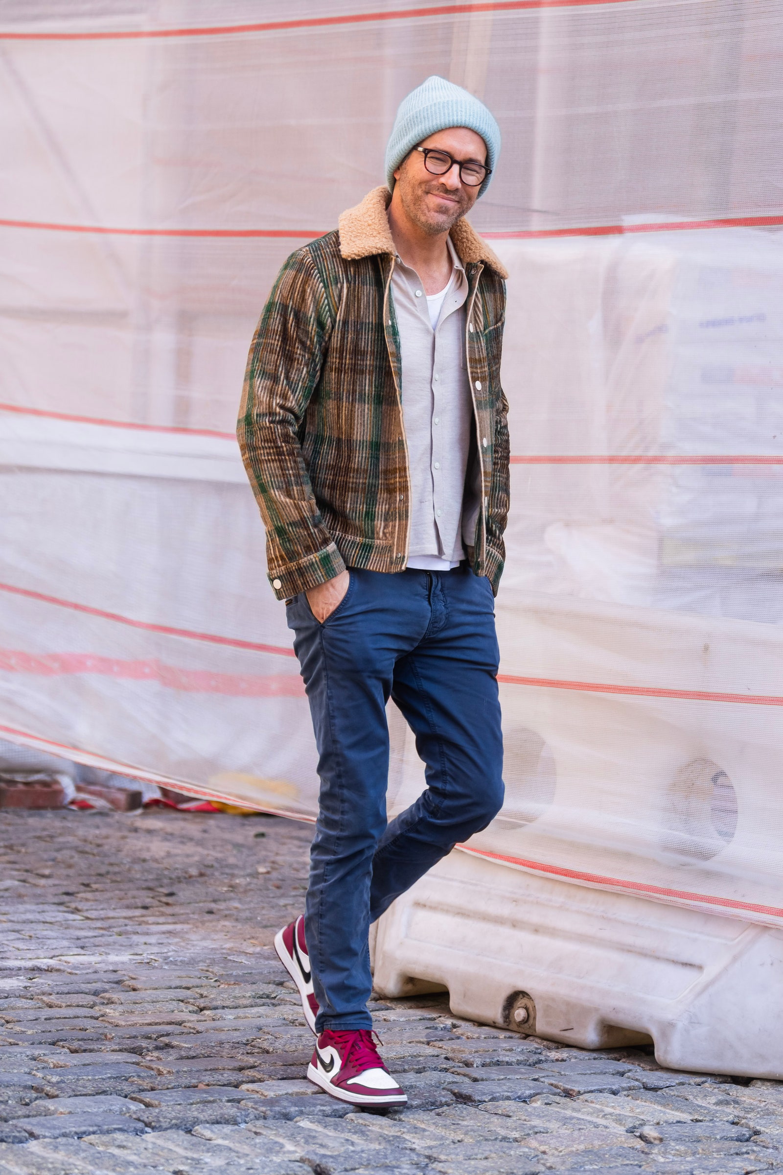 Image may contain Ryan Reynolds Clothing Pants Jeans Hat Footwear Shoe Accessories Glasses Adult and Person