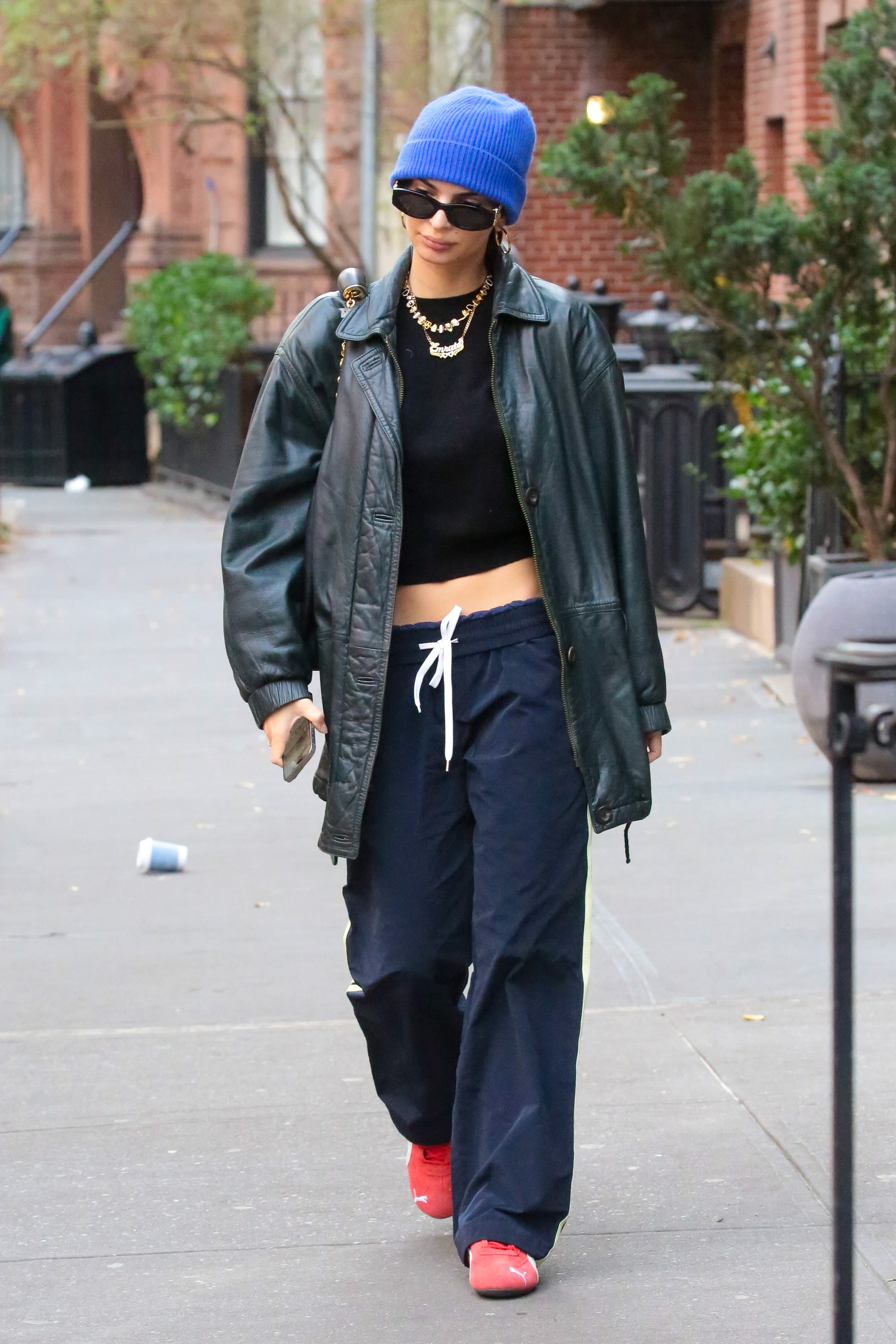 Image may contain Emily Ratajkowski Clothing Pants Hat Footwear Shoe Accessories Glasses Cap Adult and Person