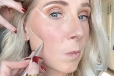 Makeup artist Lauren Hale demonstrating how to apply concealer over 40