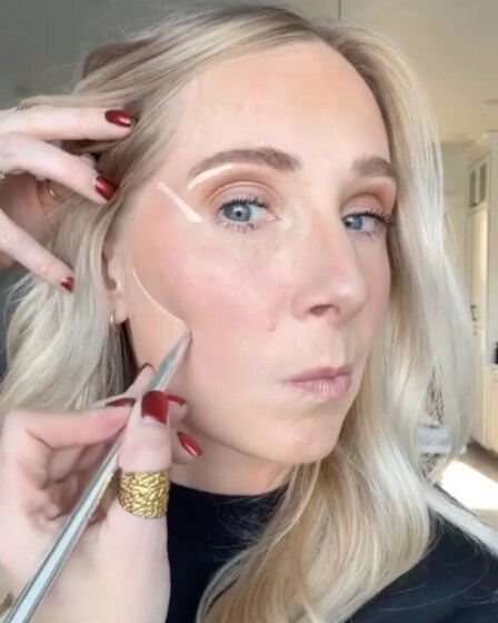 Makeup artist Lauren Hale demonstrating how to apply concealer over 40
