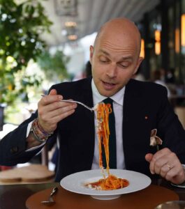 bald man about to eat a spaghetti