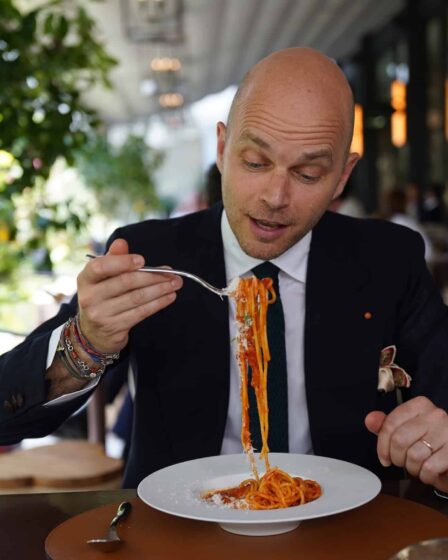 bald man about to eat a spaghetti