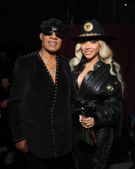 Image may contain Stevie Wonder Beyonc Clothing Coat Jacket Adult Person Hat Accessories Jewelry and Necklace