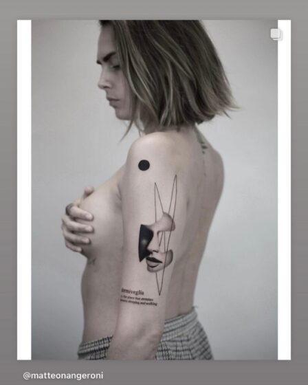 Cara Delevingne poses topless showing off new arm tattoo