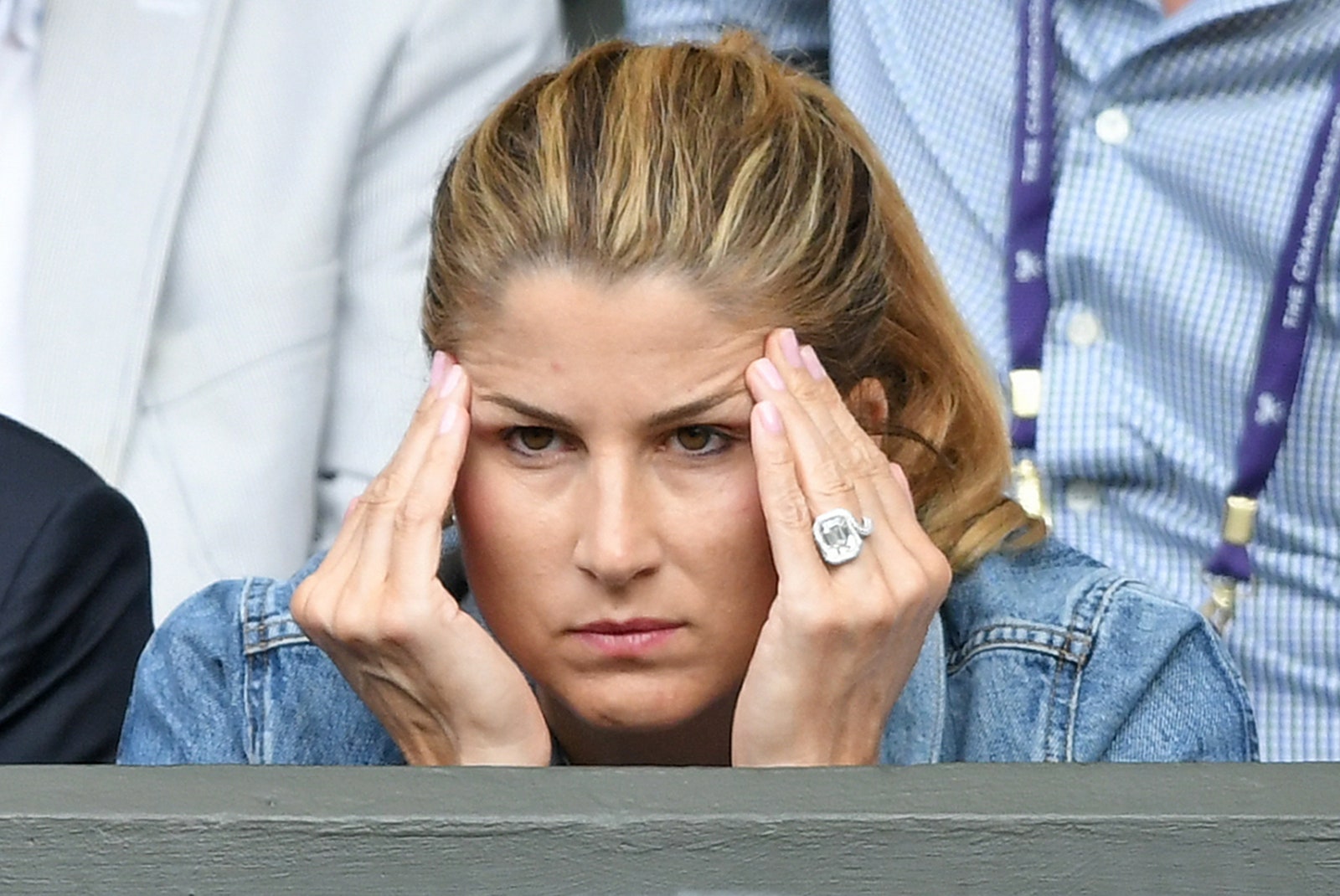 Image may contain Mirka Federer Head Person Face Accessories Jewelry Ring Sad Adult and Child