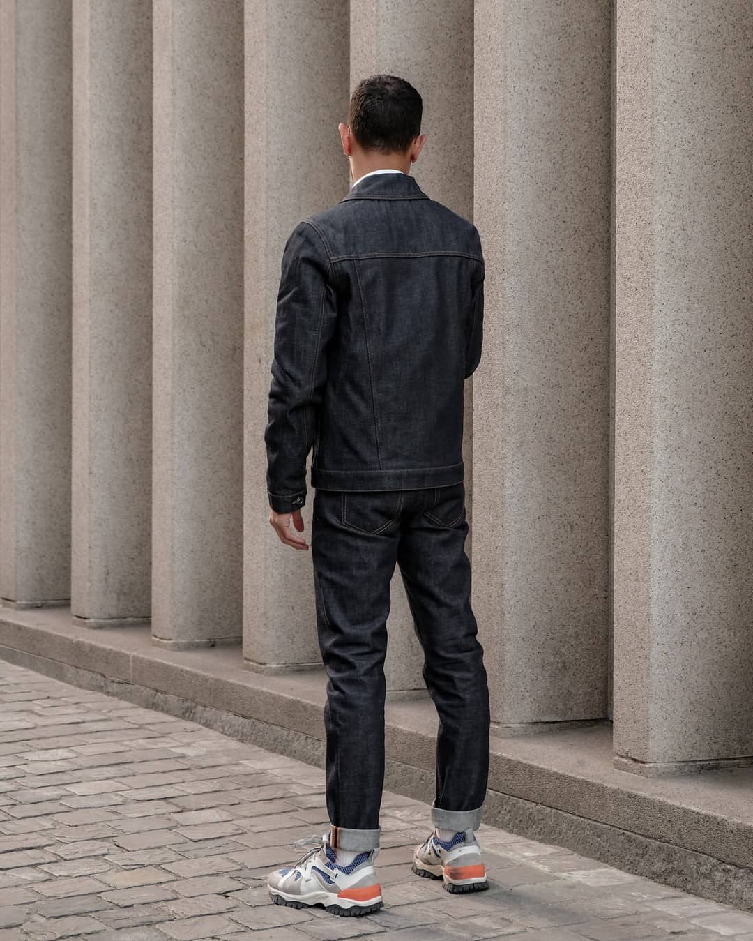 back view of a man in denim clothing