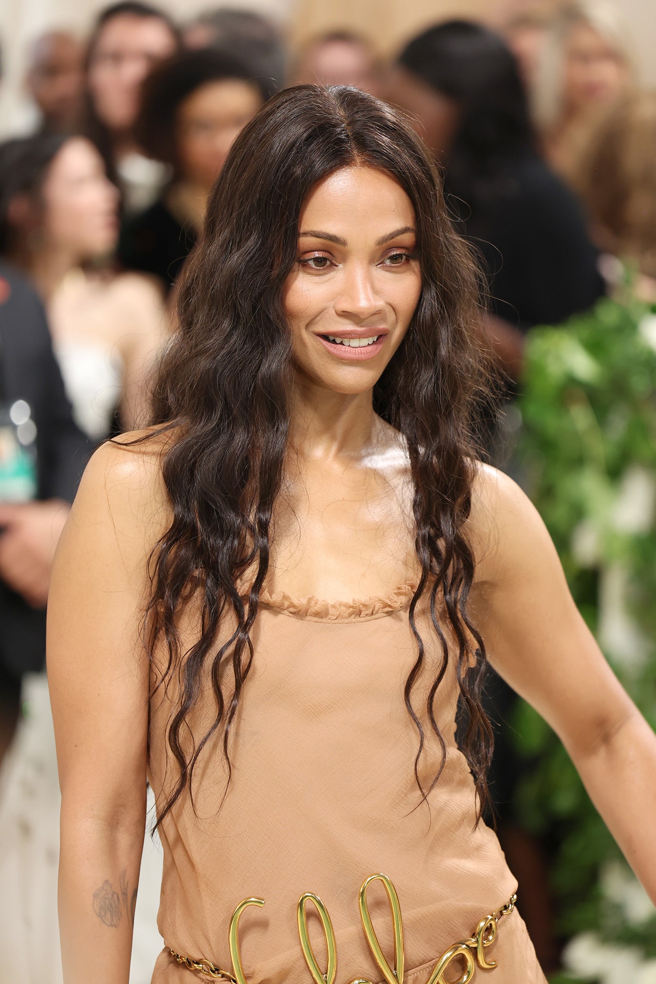 Image may contain Zoe Saldana Adult Person Face Happy Head Smile Black Hair Hair Fashion and Child