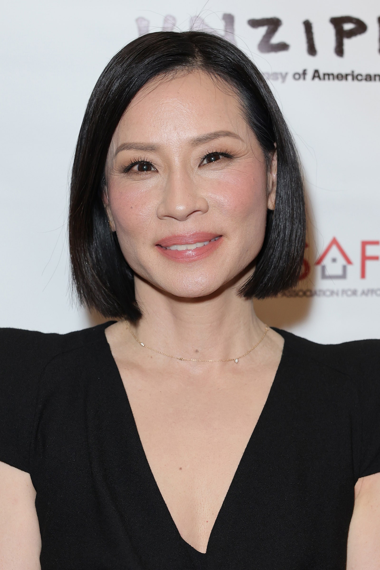 Image may contain Lucy Liu Head Person Face Adult Accessories Jewelry Necklace Black Hair Hair and Dimples