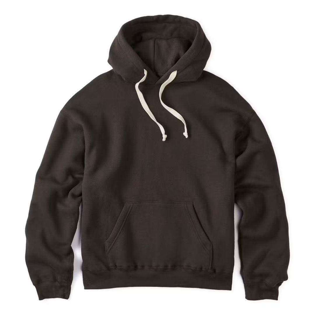 black hoodie sweatshirt with white strings against a white background