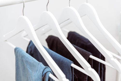jeans hanging on a rack