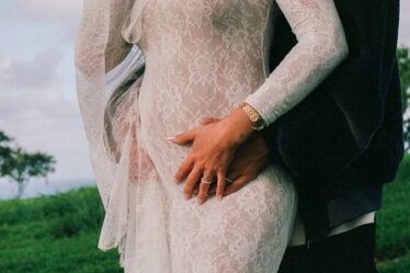 Image may contain Clothing Dress Fashion Formal Wear Gown Wedding Wedding Gown Long Sleeve Sleeve Adult and Person