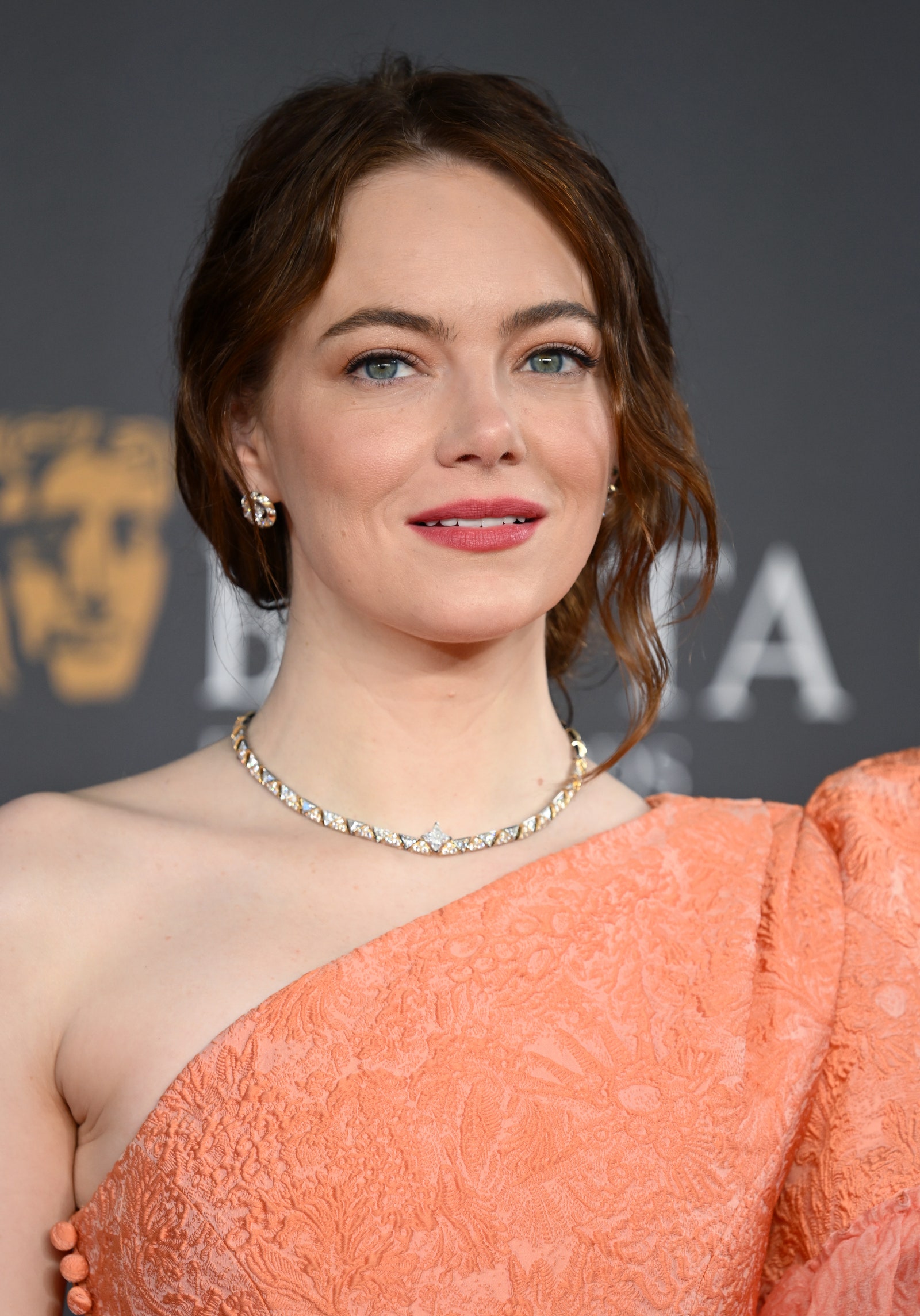 Image may contain Emma Stone Accessories Jewelry Necklace Head Person Face Adult Formal Wear Clothing and Dress