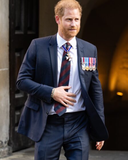 Image may contain Prince Harry Duke of Sussex Blazer Clothing Coat Jacket Formal Wear Suit Accessories and Tie