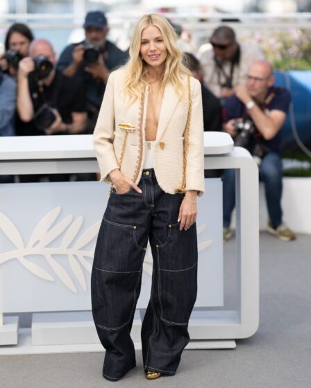 Image may contain Sienna Miller Clothing Pants Jeans Adult Person Camera Electronics Footwear Shoe and Hat