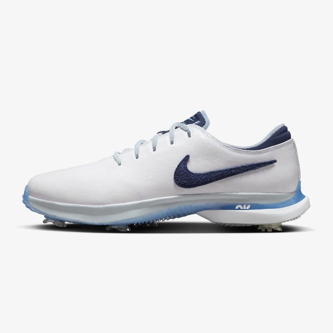 white and navy nike air zoom victory tour 3 NRG shoe from the side