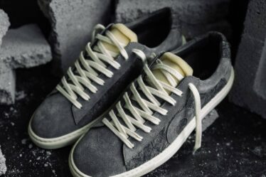 a pair of oliver cabell low 1 surrounded with broken concrete blocks