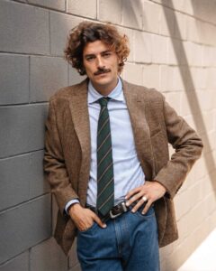 man wearing a brown classic italian style blazer by velasca
