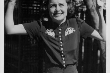 Image may contain Olivia de Havilland Face Head Person Photography Portrait Adult Happy Smile Body Part and Finger