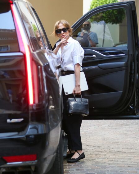 Image may contain Jennifer Lopez Accessories Glasses Bag Handbag Adult Person Clothing Footwear Shoe and Car