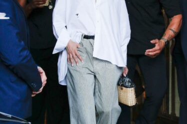 Jennifer Lopez left the hotel in Paris after the L Show during Paris Fashion Week. As she headed to the airport, Jen chose a comfortable outfit of straight pants and a white shirt.
