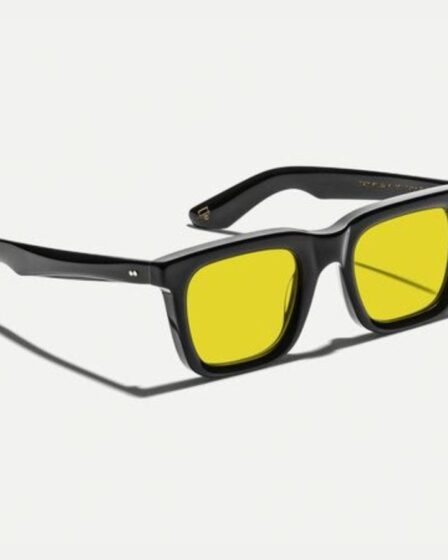 pair of moscot yellow lens sunglasses with black frames