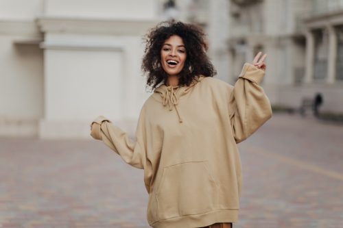 stylish woman in oversized hoodie