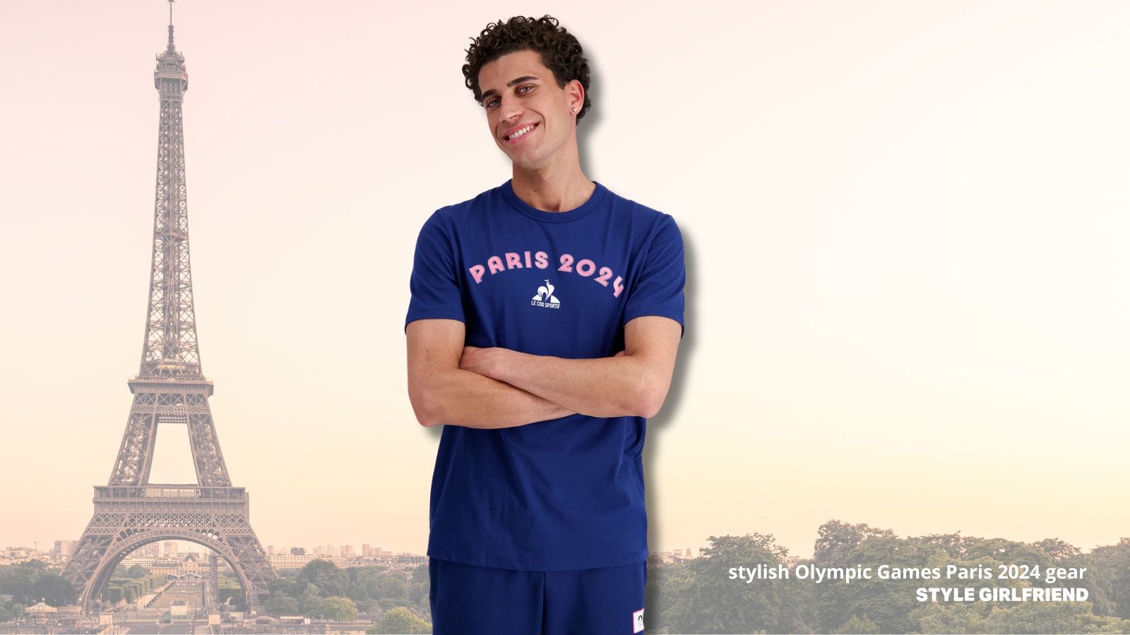 man from the waist up wearing a 'paris 2024' blue t-shirt with pink lettering