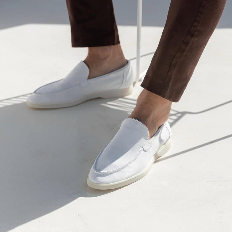 wearing a pair of all white loafers by Aurelien