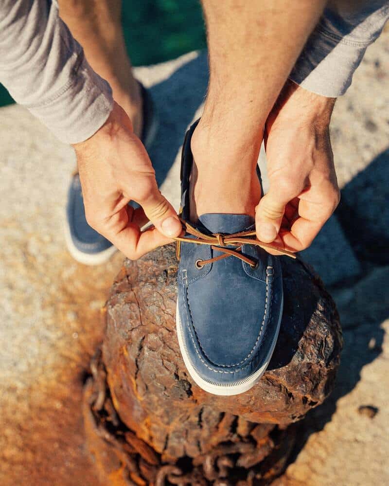 fixing a shoelace of a gambaree boat shoe by velasca