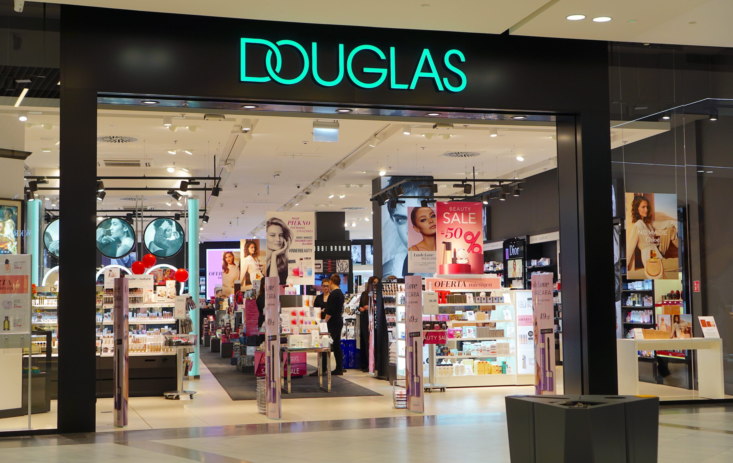 Douglas Raises Sales Forecast, Divests Pharmacy Business