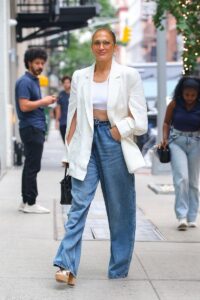 Jennifer Lopez is all smiles in NYC wearing white crop top and wedge platforms
