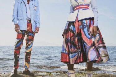 A man and a woman in bright patterns.