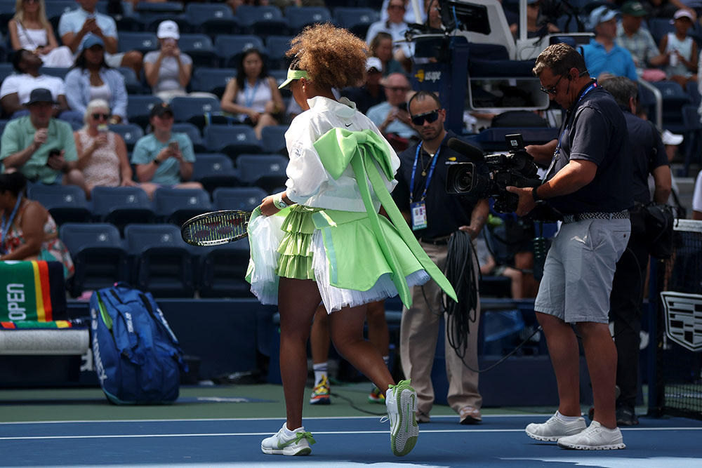 Naomi Osaka of Japan walks on court before playing against Jelena Ostapenko of Latvia during their Women's Singles First Round match on Day Two of the 2024 US Open