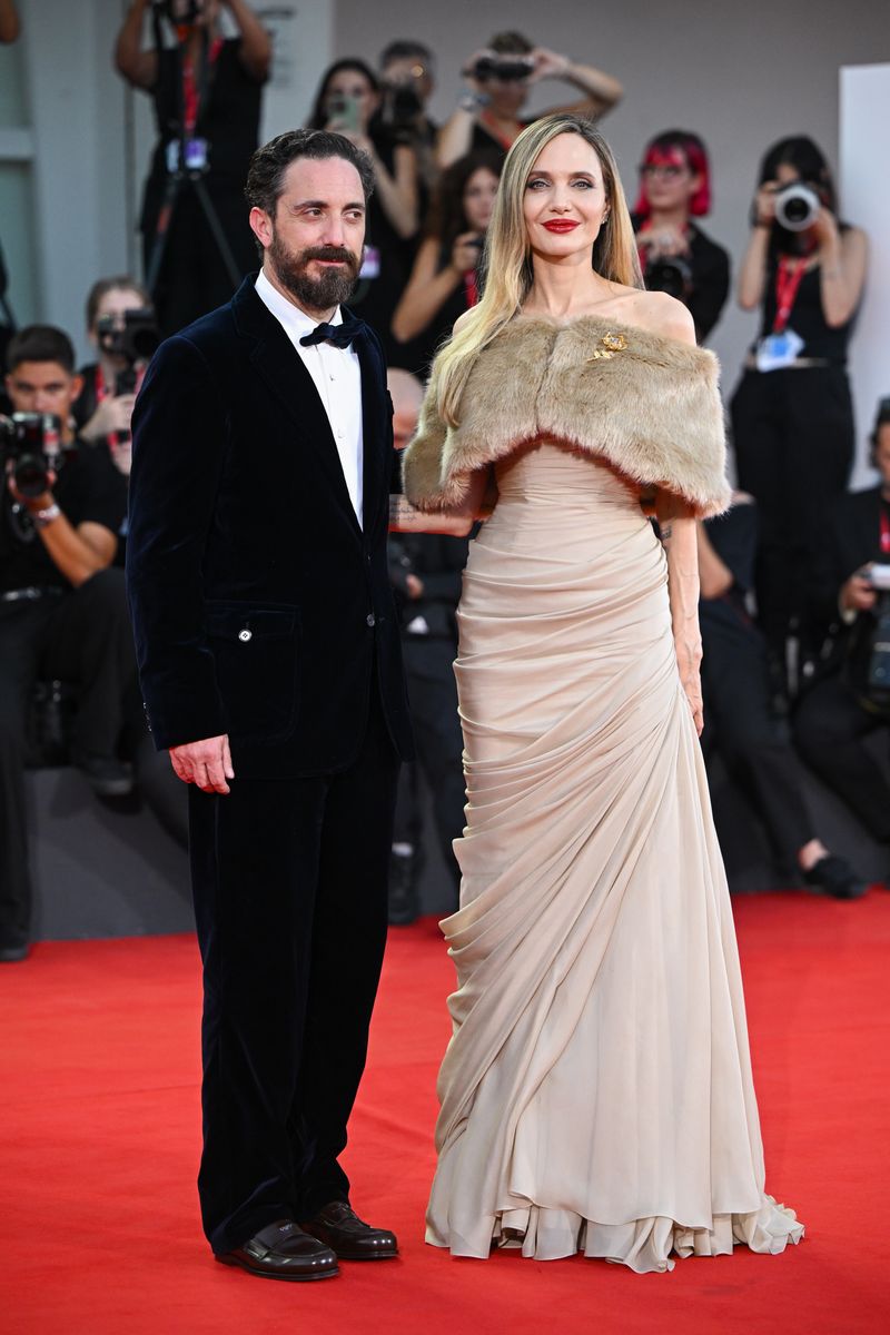 Pablo Larrain and Angelina Jolie attend a red carpet for "Maria" during the 81st Venice International Film Festival 