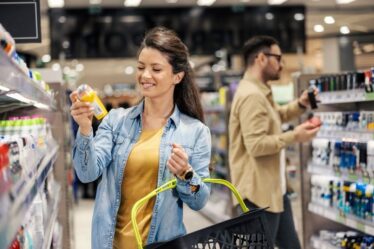 woman buying deodorant at store