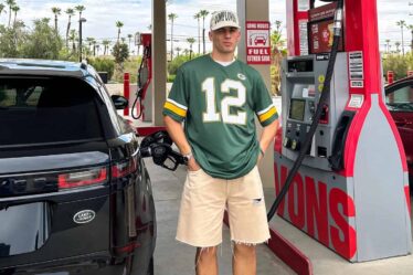 man filling car with fuel