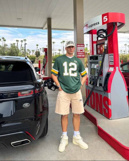 man filling car with fuel