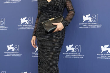 Monica Bellucci attends a photocall for the movie "Beetlejuice Beetlejuice" during the 81st Venice International Film Festival