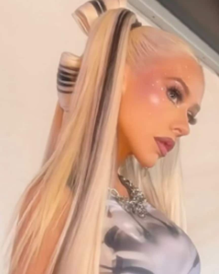 Christina Aguilera wears stunning mini skirt set in Tokyo paired with chain jewelry