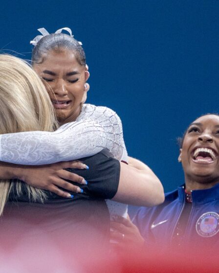 Image may contain Simone Biles Hugging Person Adult People and Head