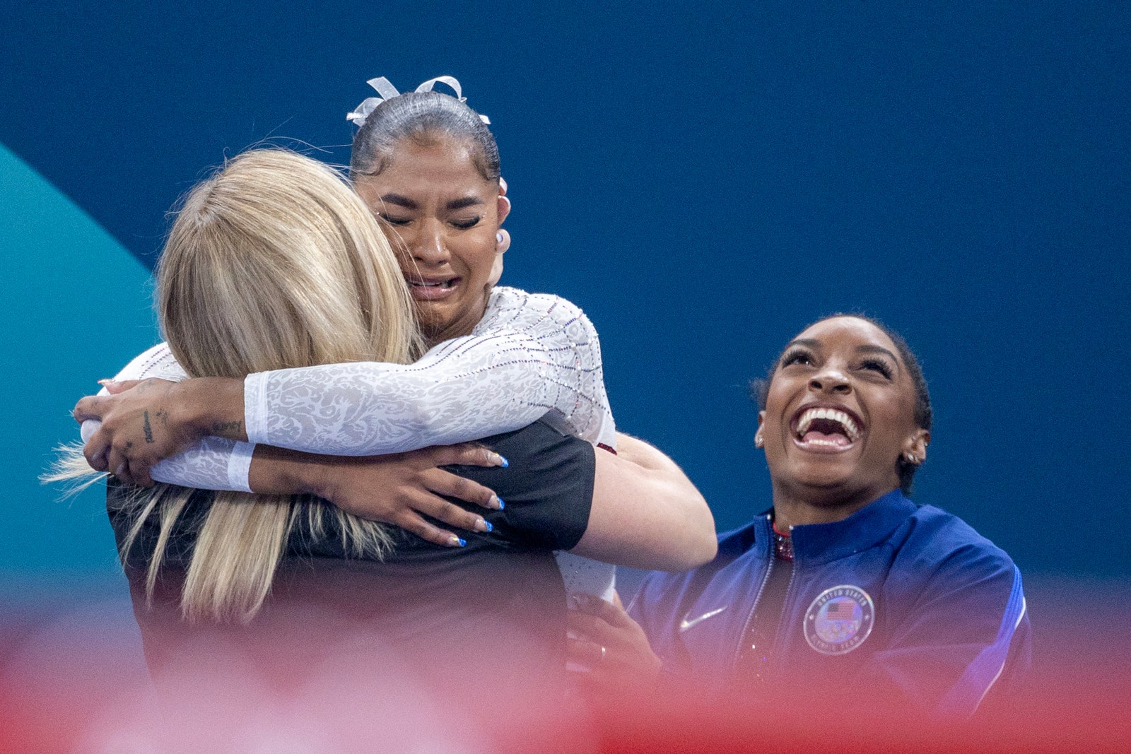 Image may contain Simone Biles Hugging Person Adult People and Head