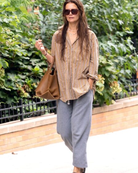 Image may contain Katie Holmes Clothing Pants Accessories Bag Handbag Footwear Sandal Adult Person and Glasses