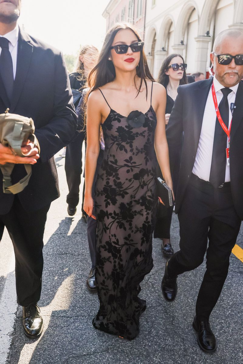 Olivia Rodrigo and Actor Louis Partridge at the 81st Venice International Film Festival being escorted to the premiere of 'Disclaimer'.