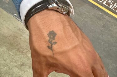 Jonathon Johnson rose tattoo hand watch arm