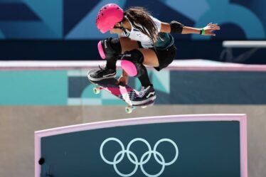 Arisa Trew competing at the Olympics in a kit by Asics and footwear by Vans.