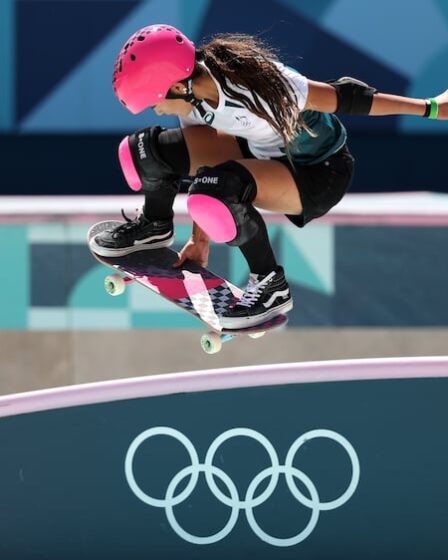 Arisa Trew competing at the Olympics in a kit by Asics and footwear by Vans.