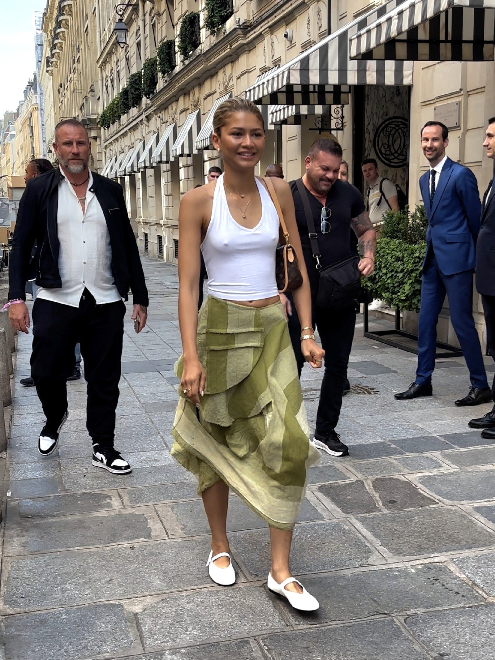 Image may contain Zendaya Pedestrian Person Accessories Bag Handbag Clothing Footwear Shoe Glasses and Adult